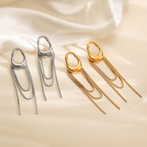 18K gold plated stainless steel tassel earrings in gold and silver finish on fabric