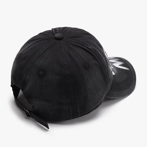 Vintage black washed cotton baseball cap with white graffiti letters and adjustable strap