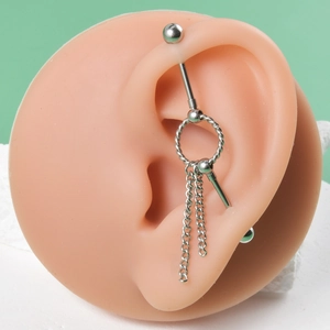 Industrial barbell earring with twist ring and double chain tassels on an ear model