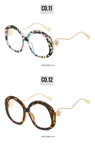 Detailed view of floral and tortoiseshell round sunglasses with pearl metal temples