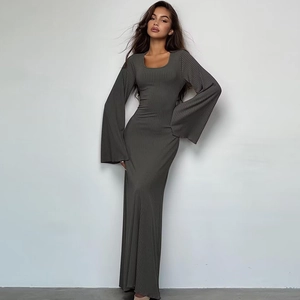 Close-up of long flare sleeves and ribbed knit texture on a gray maxi dress