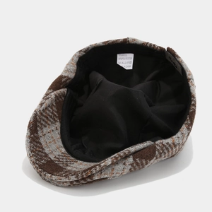 Detail view of the vintage plaid cap showing the 10% wool fabric texture and inner lining