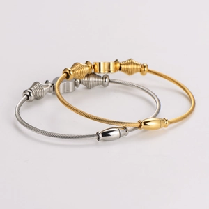 Twisted stainless steel wire rope bracelet with clover pendant in gold and silver