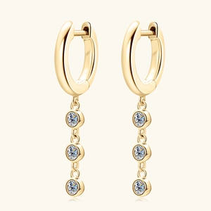 Elegant gold drop earrings with triple round-cut stones and classic polished finish
