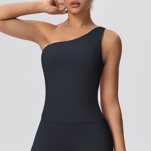 Detail of black one-shoulder sports top with smooth matte texture and elastic fit