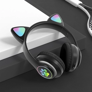 Detail of black cat ear headphones featuring glowing paw design for gaming and kids