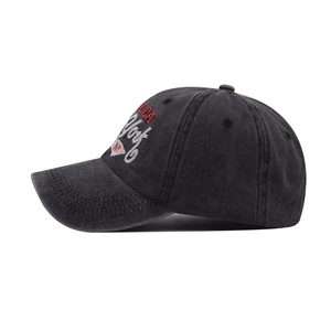 Detail of washed cotton texture and red America embroidery on vintage baseball cap