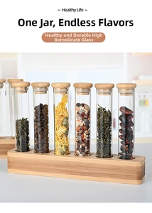 Vertical glass test tube storage set with six spice jars on a natural bamboo stand