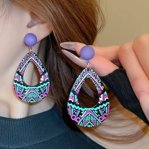 Vintage acrylic teardrop earrings with colorful geometric patterns and purple studs