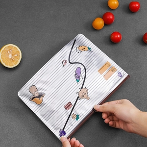 FSA white notebook with cartoon vegetable patterns on a textured grey background