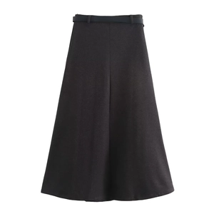 Close-up of black A-line midi skirt showing the thick wool fabric texture and thin belt detail