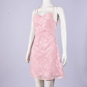 Detail of pink floral embroidery and 3D petal texture on the backless summer strap dress
