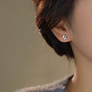 S999 Sterling Silver double butterfly stud earrings with sparkling cubic zirconia on model