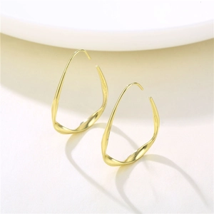 Polished golden teardrop hoop earrings with a modern geometric twisted design for women