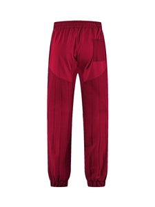 Detail view of dark red casual pants featuring vertical pleated texture and back pocket