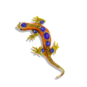 Vintage lizard brooch with blue crystals and green enamel on a polished alloy base