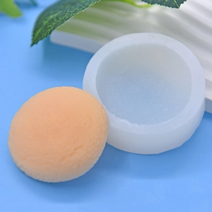 Round silicone mold for DIY baking, shown with a textured macaron dessert on light blue base