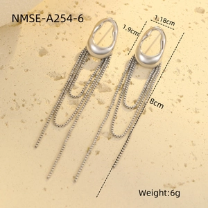 Detailed macro view showing silver tassel earrings with dimensions 1.18cm by 8cm