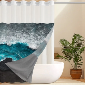 Detail showing the waterproof ocean wave print and metal grommets of the bathroom shower curtain