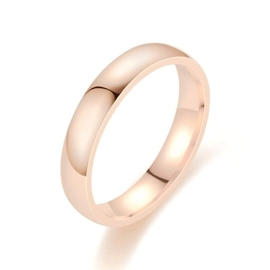 Macro shot of 4mm rose gold stainless steel ring with polished surface on white background