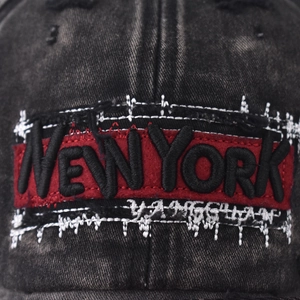Washed vintage black denim baseball cap with 3D red New York embroidery and distressed detail