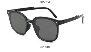 Detailansicht der faltbaren schwarzen Sonnenbrille im 45-Grad-Winkel mit Scharnieren