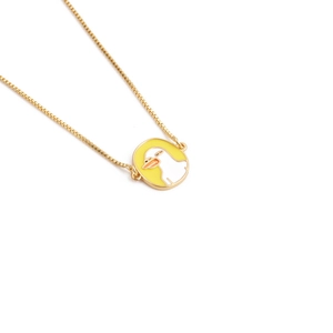 Detail of a gold box chain with a yellow and white enamel duck pendant necklace