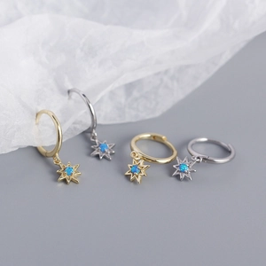 Close-up of S925 silver star-shaped hoop earrings with blue opal stone in gold and silver