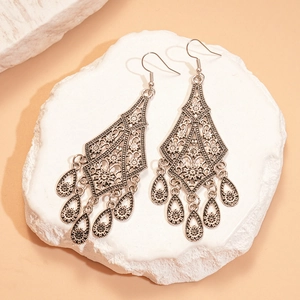 Vintage hollow flower teardrop tassel earrings in retro silver bohemian ethnic style