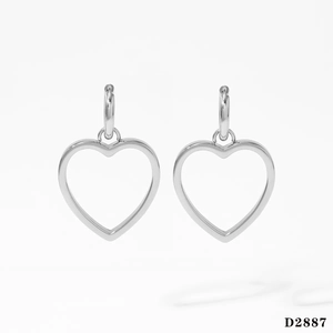Close-up of heart-shaped hollow earrings in polished silver stainless steel finish
