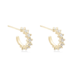 Detail view of gold-plated huggie hoop earrings featuring a row of sparkling cubic zirconia