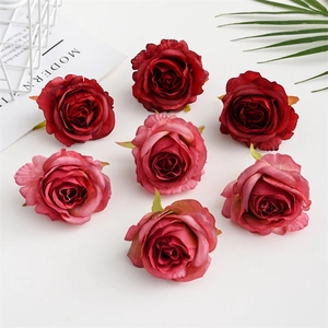 Detail of seven red artificial silk rose heads for wedding arch and floral wall decor