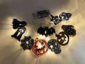Close-up of LED Halloween string lights with pumpkin, bat, and ghost motifs with battery box