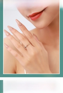 Close-up of a slim S925 silver ring with colorful rainbow gemstones on a model's hand