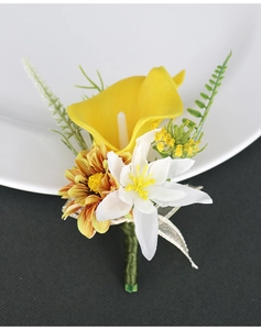 Macro shot of realistic yellow calla lily wedding boutonniere on white porcelain plate