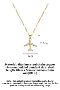 Detail showing dimensions of the gold airplane pendant with micro-set zircons and steel chain