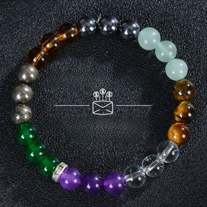 Detailed view of the multi-colored gemstone bead bracelet with Money & Success text