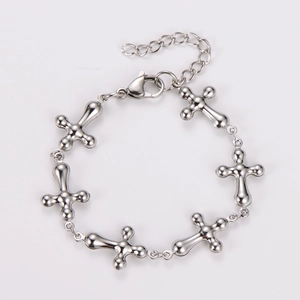 Detailed shot of stainless steel cross bracelet with lobster clasp and extender chain