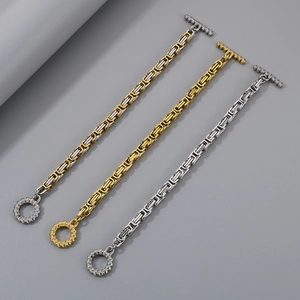 Close-up of Byzantine stainless steel bracelets in gold, silver, and dual-tone finish