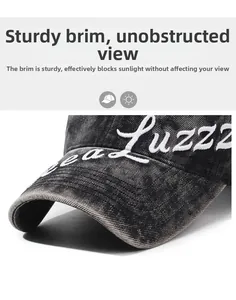 Detail of reinforced brim on washed grey baseball cap with white letter embroidery