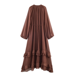 Brown Bohemian maxi dress with long lantern sleeves and tiered ruffle hem on white background