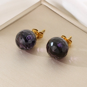 Detailed shot of purple crystal ball earrings with gold-plated titanium steel studs