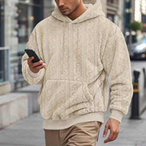 Detail of men's apricot cable-knit teddy fleece hoodie with kangaroo pocket and drawstring