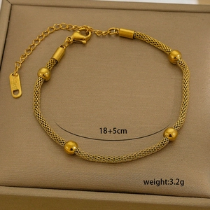 Detailed close-up of 18K gold plated stainless steel beaded mesh chain with size tag