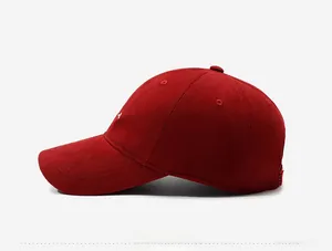 Detailed side view of dark red baseball cap showing cotton twill texture and logo