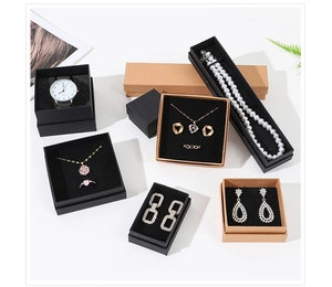 Various sizes of kraft and black jewelry gift boxes with black velvet lining for accessories