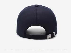 Detail of navy blue cotton baseball cap featuring adjustable metal buckle with FARD engraving