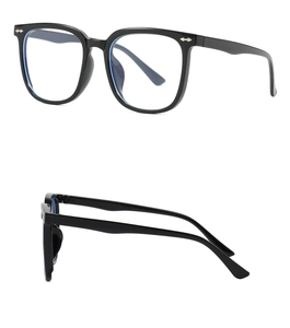 Detail of square black frame glasses with silver arrow rivets and blue light filter lens