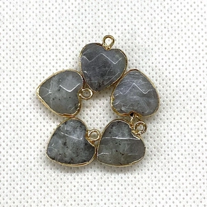 Close-up of five heart-shaped grey stones with gold plating and top hanging loops