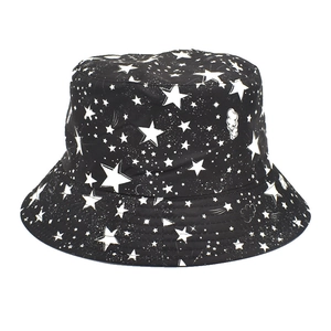 Detail of black bucket hat featuring white star prints and celestial galaxy patterns